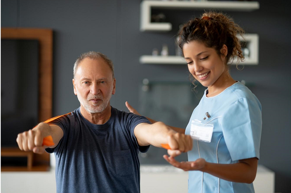 Physical therapist working with a patient 